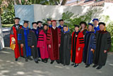 President Rush plus the original thirteen faculty in regalia (2001-2002).